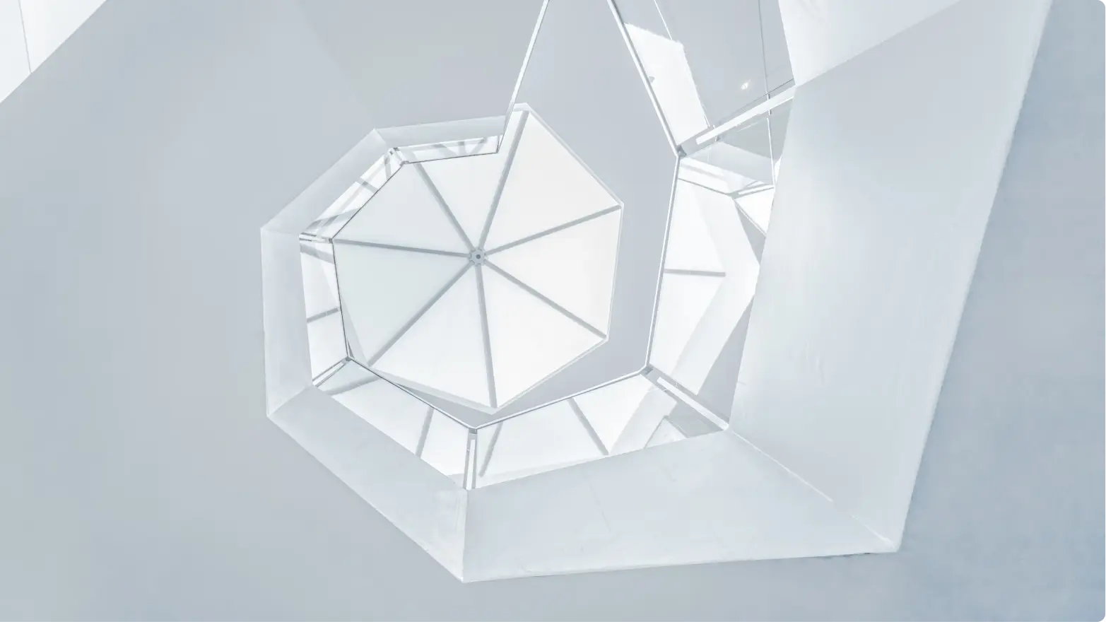White, elegant spiral photography of hexagonal stairs.
